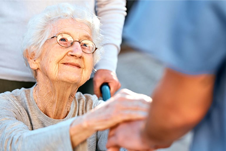 Eldery women happy to see her caregiver